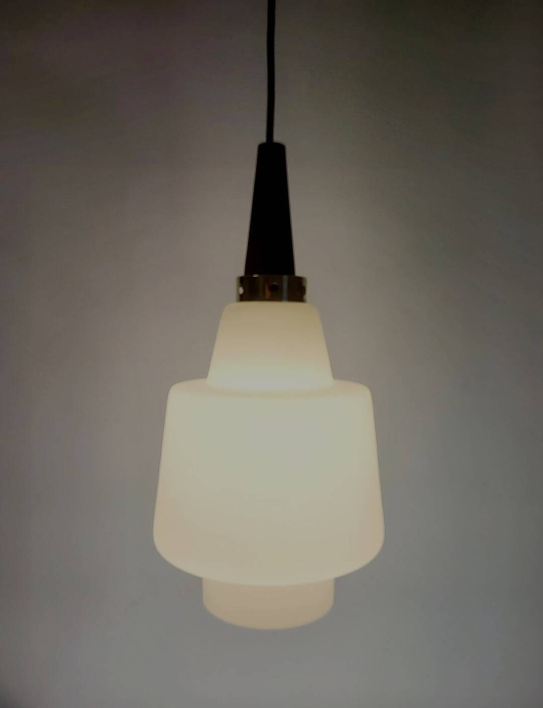 Scandinavian pendant light in opaline and teak, around 1960.