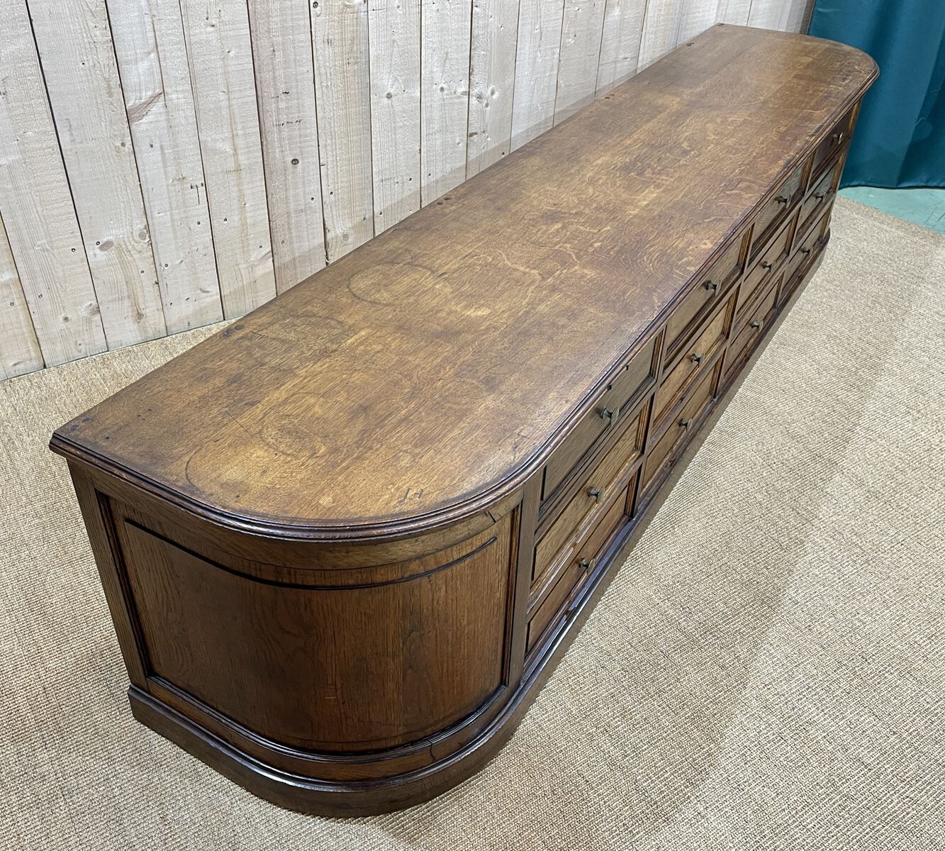 Long low oak countertop with 12 drawers - early XXth