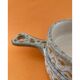 Ceramic pocket emptier