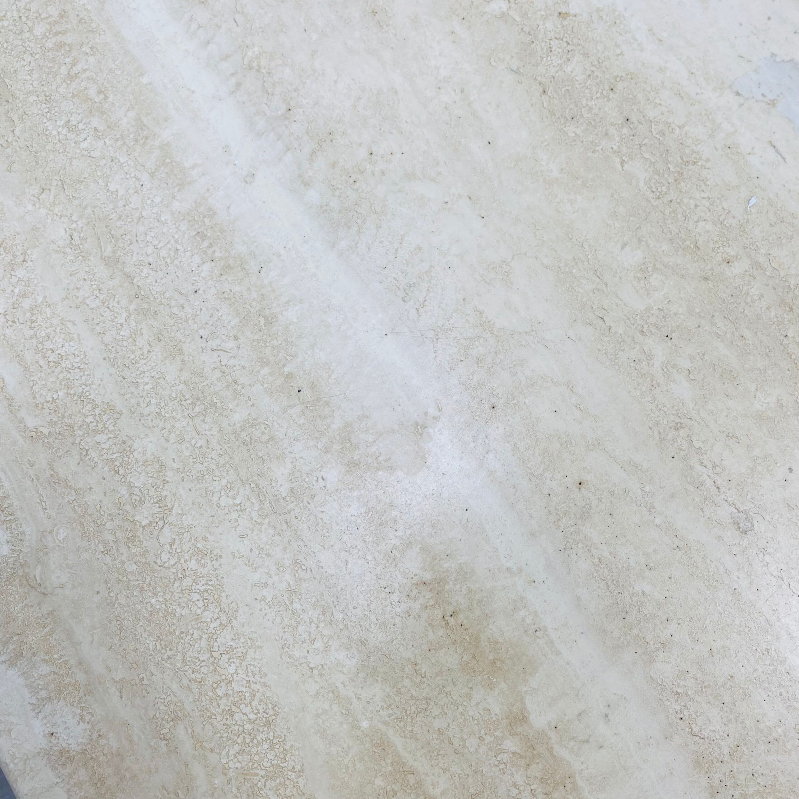Travertine eye coffee table Roche Bobois