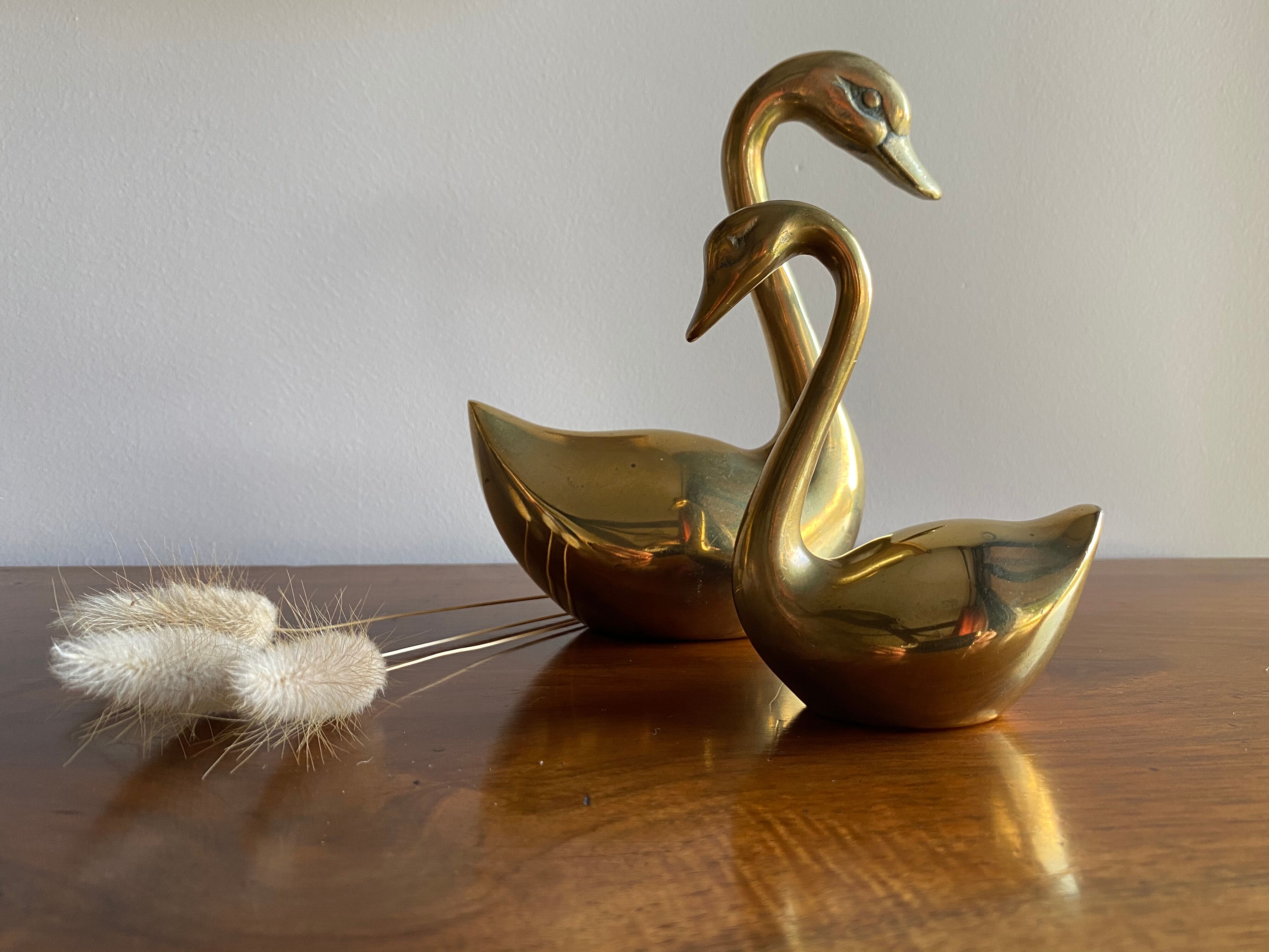 Duo of ancient brass swans