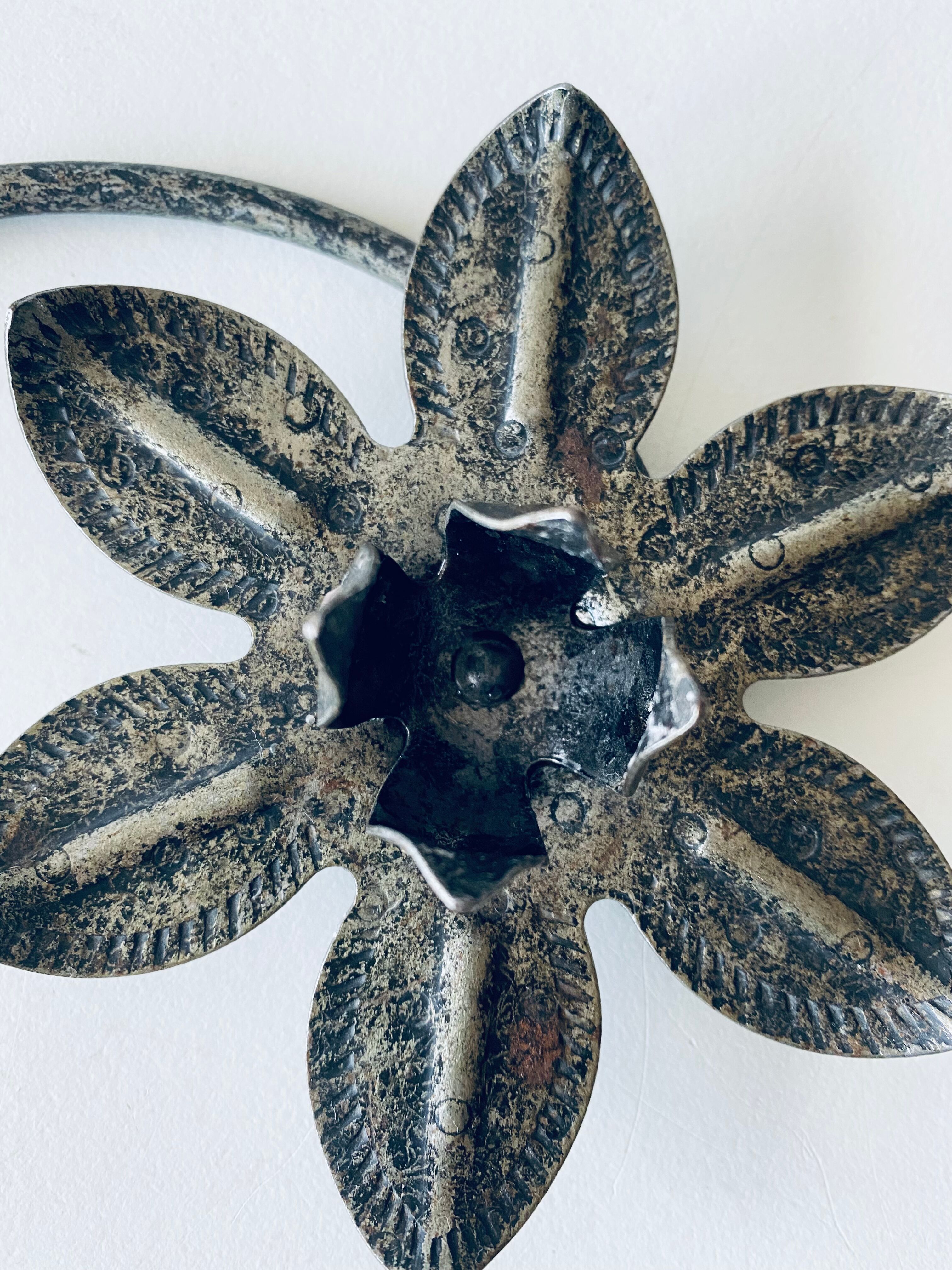 Pair of iron water lily candle holders