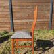 Set of 8 teak lounge chairs with high backs and zebra-striped seats