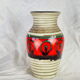 Frieze vase with green and red round
