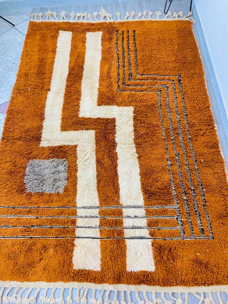 Modern Moroccan rug in rust wool with cream lines 150/250 cm