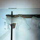 2 brutalist steel side tables with primitive  scene motifs etched glass