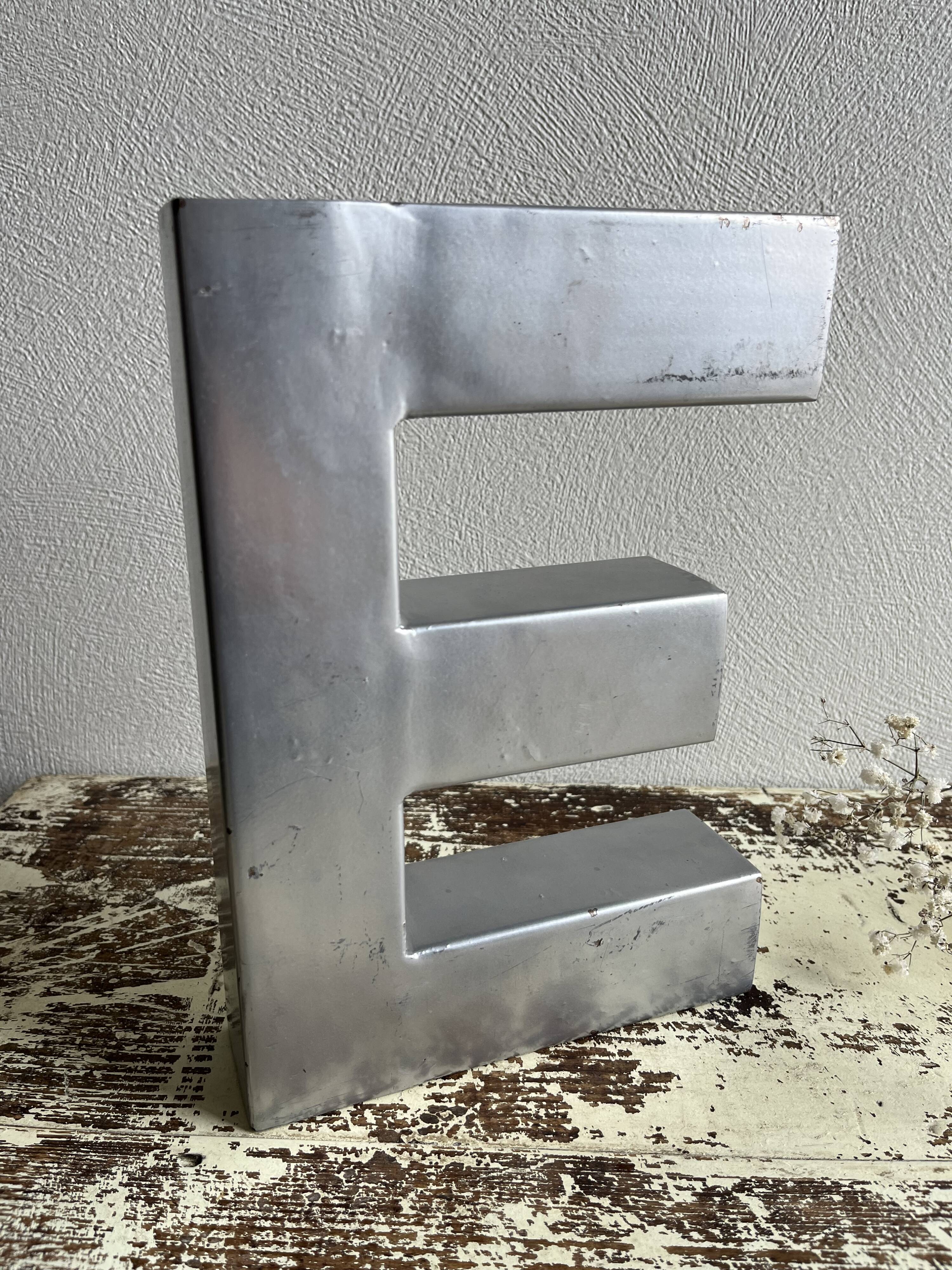 Metal sign letter E