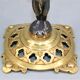 Pair of candle holders in gilded bronze and patinated with a candle
