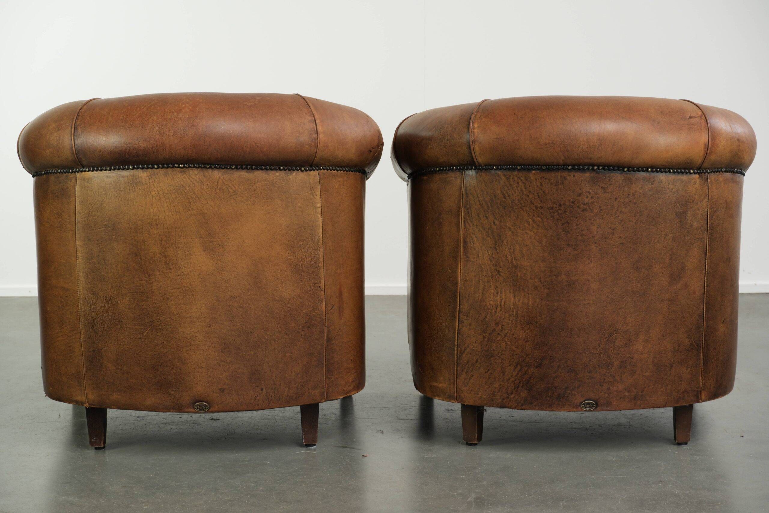 Sturdy set of vintage sheepskin club armchairs with a great appearance