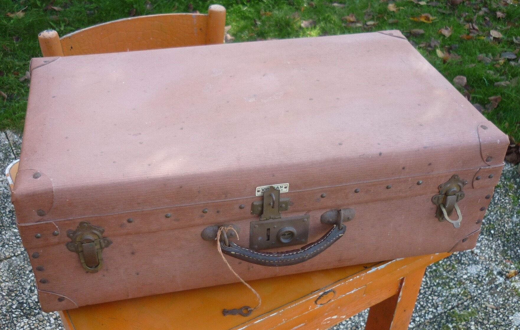 Green cardboard suitcase