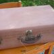 Green cardboard suitcase