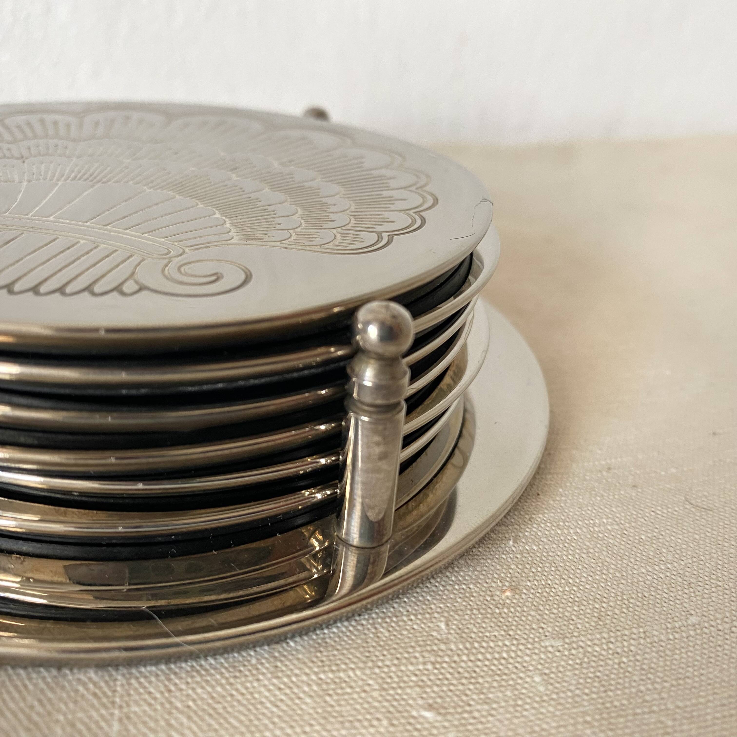 Silver coaster and holder, shell, 80s