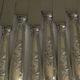 Set of 12 knives with silver metal handles and stainless steel blades.