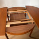 Extendable teak round table