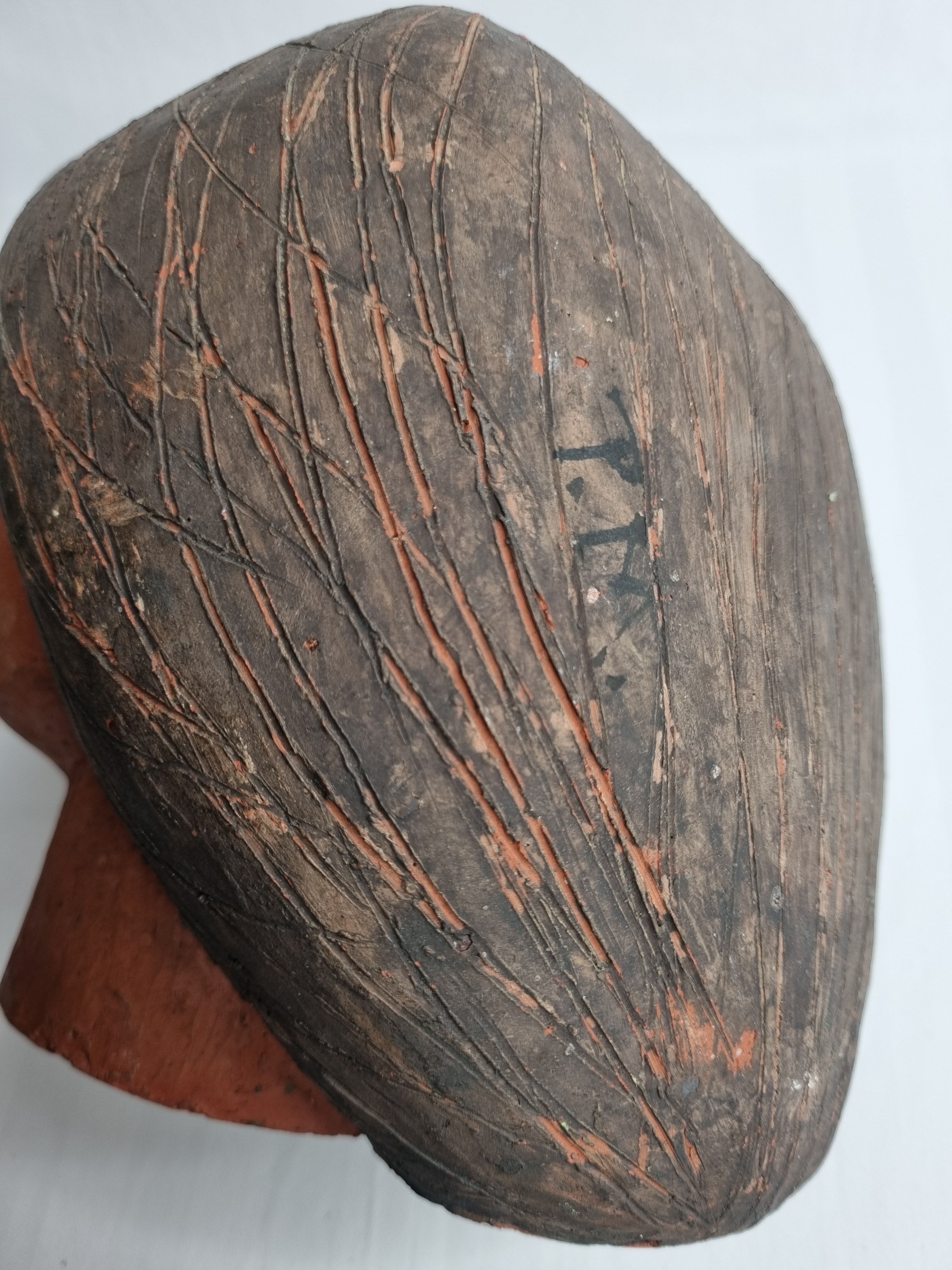 Set of 3 decorative women's heads in red terracotta