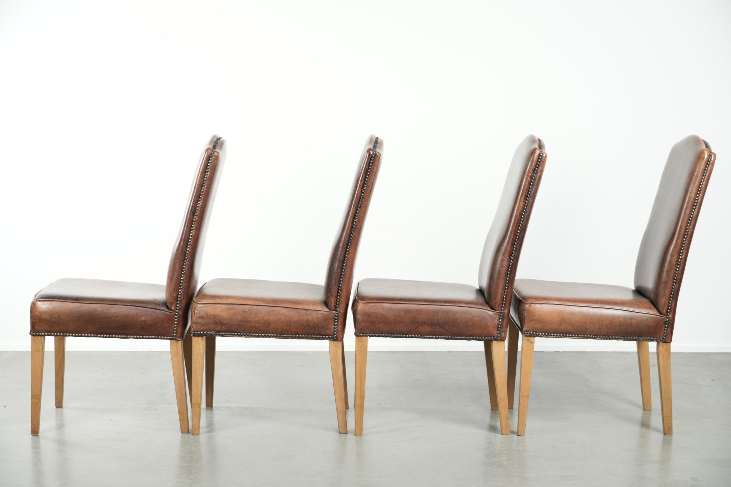 Vintage set of 4 dining chairs made of sheepskin leather with a high back