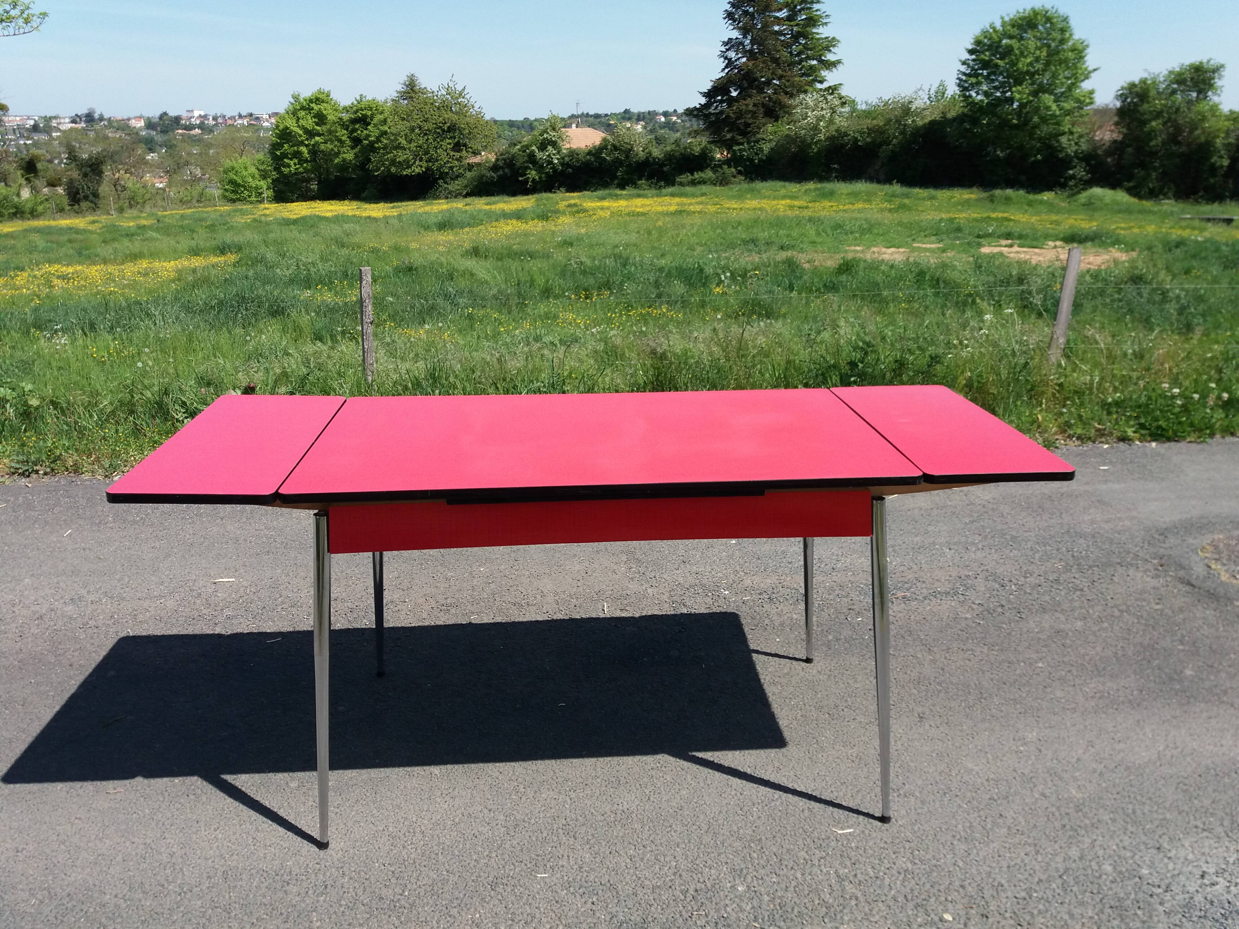 Dining table with red formica extensions