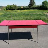 Dining table with red formica extensions