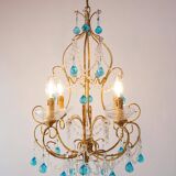 Italian chandelier in gold metal and blue crystal drops