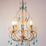 Italian chandelier in gold metal and blue crystal drops