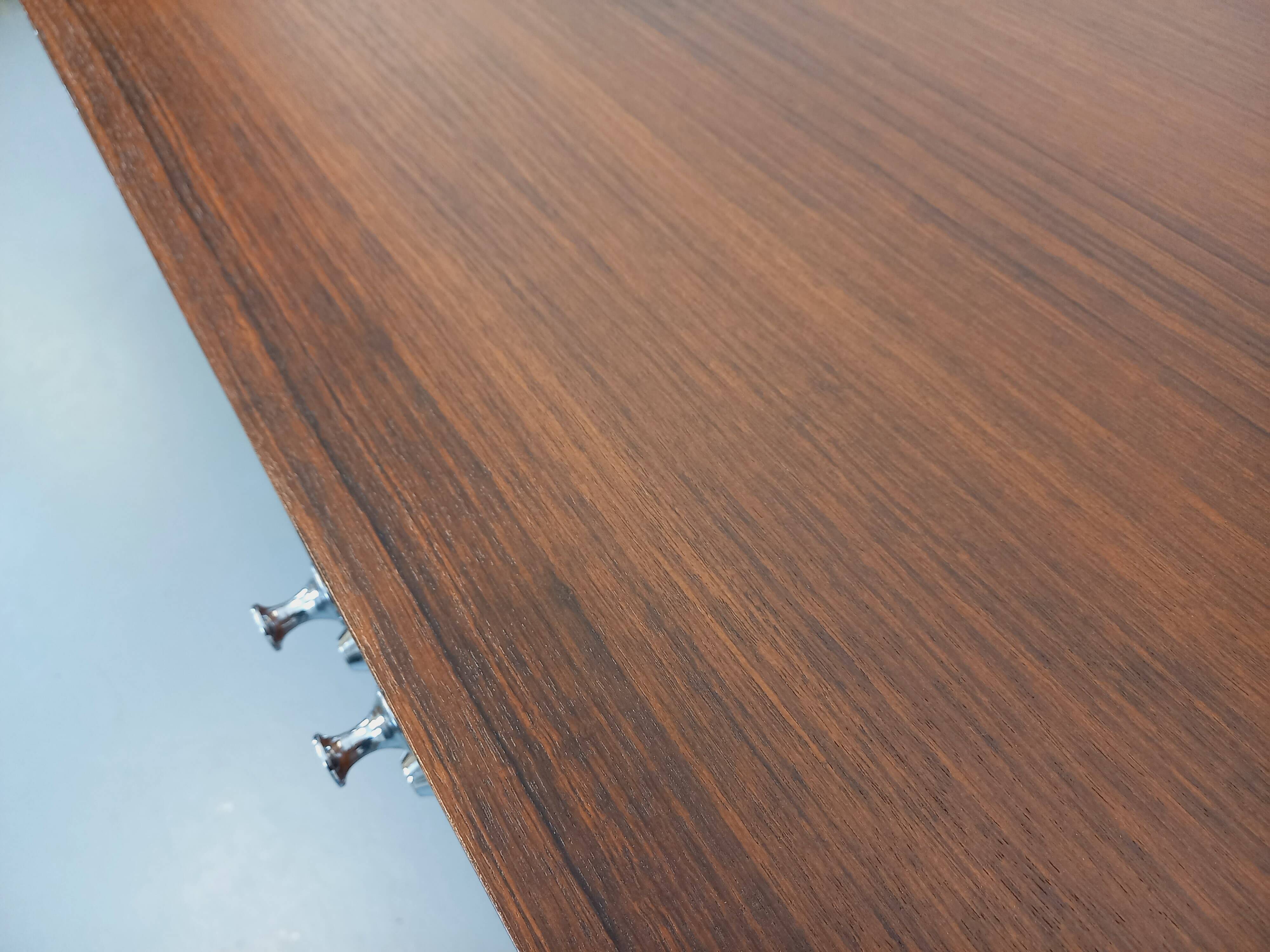 Vintage modernist enfilade in rosewood and chrome metal from the 60s and 70s.