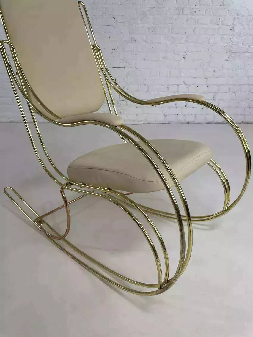 1960s rocking chair in brass and ecru imitation leather