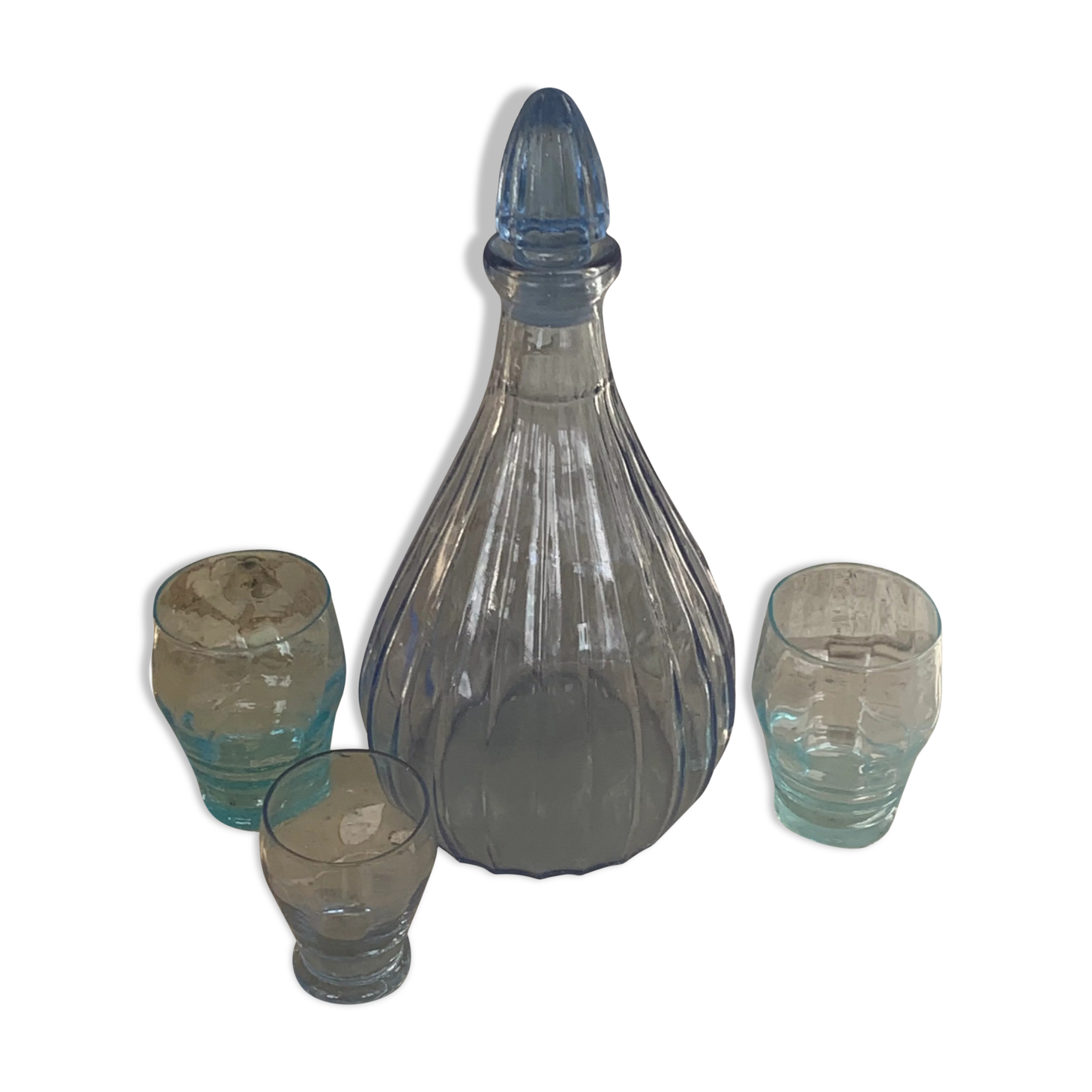 Liquor service consisting of a blue glass decanter and. 3 small antique glasses