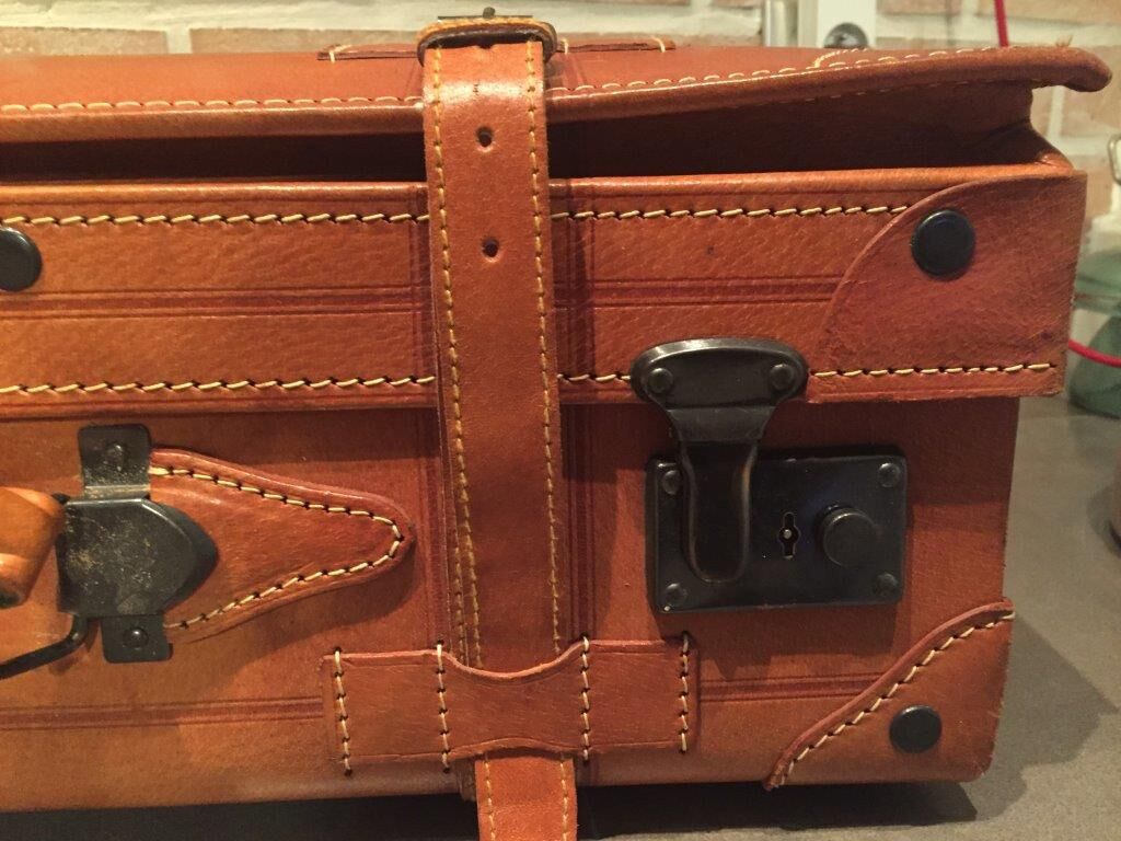 Thick leather suitcase