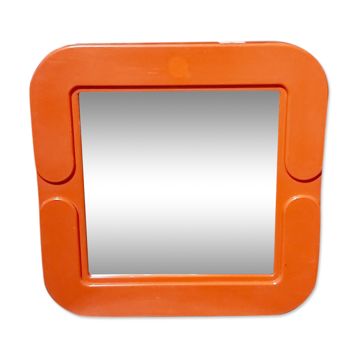 Small orange vintage mirror.