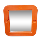 Small orange vintage mirror.