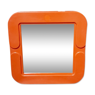 Small orange vintage mirror.