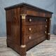 Empire commode in mahogany and flame mahogany veneer, 19th century.