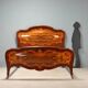Antique baroque double bed in walnut and mahogany, 20th century.