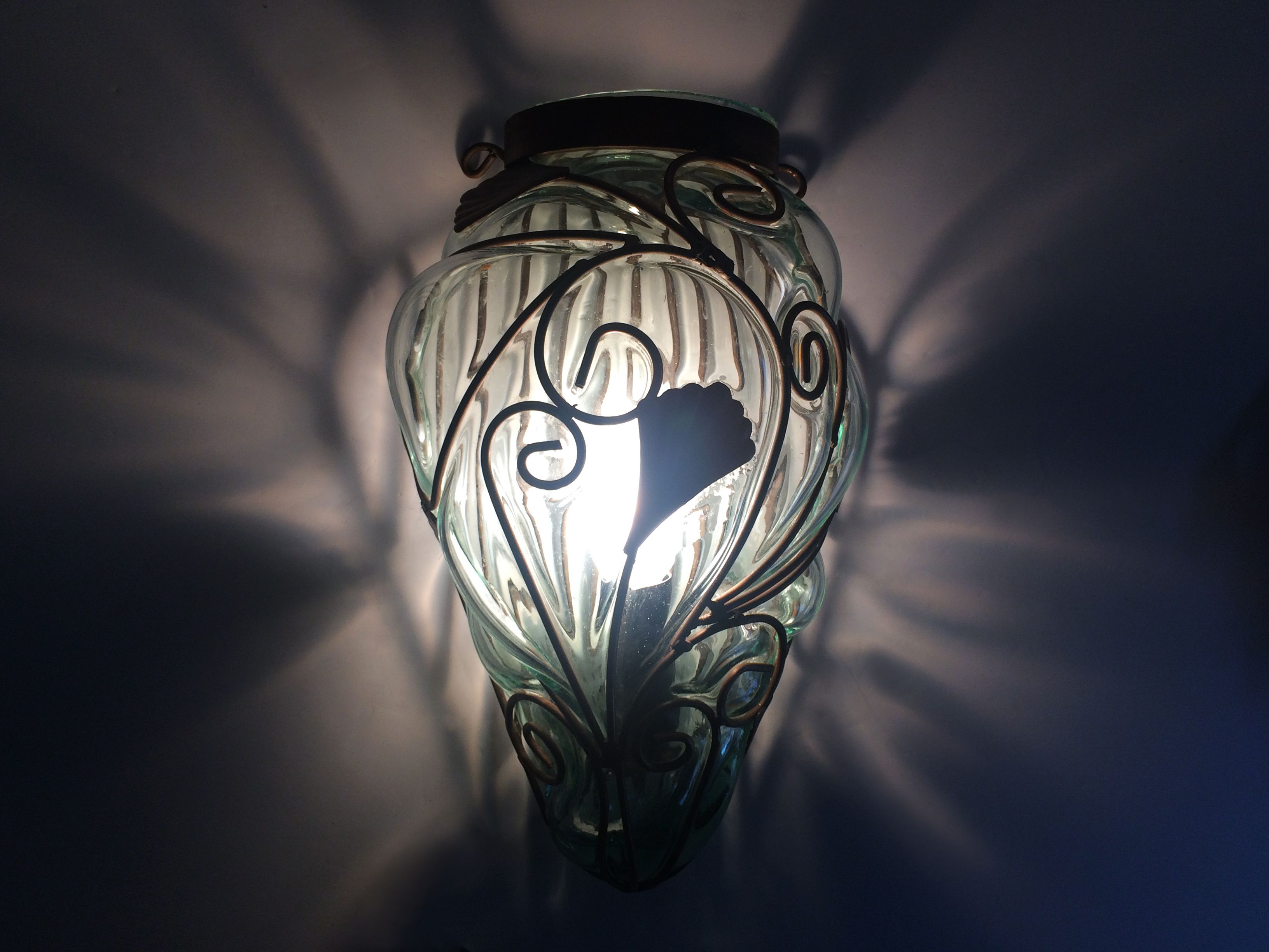 Pair of wall light cage in blown glass green color and wrought iron. Murano style. Year 80