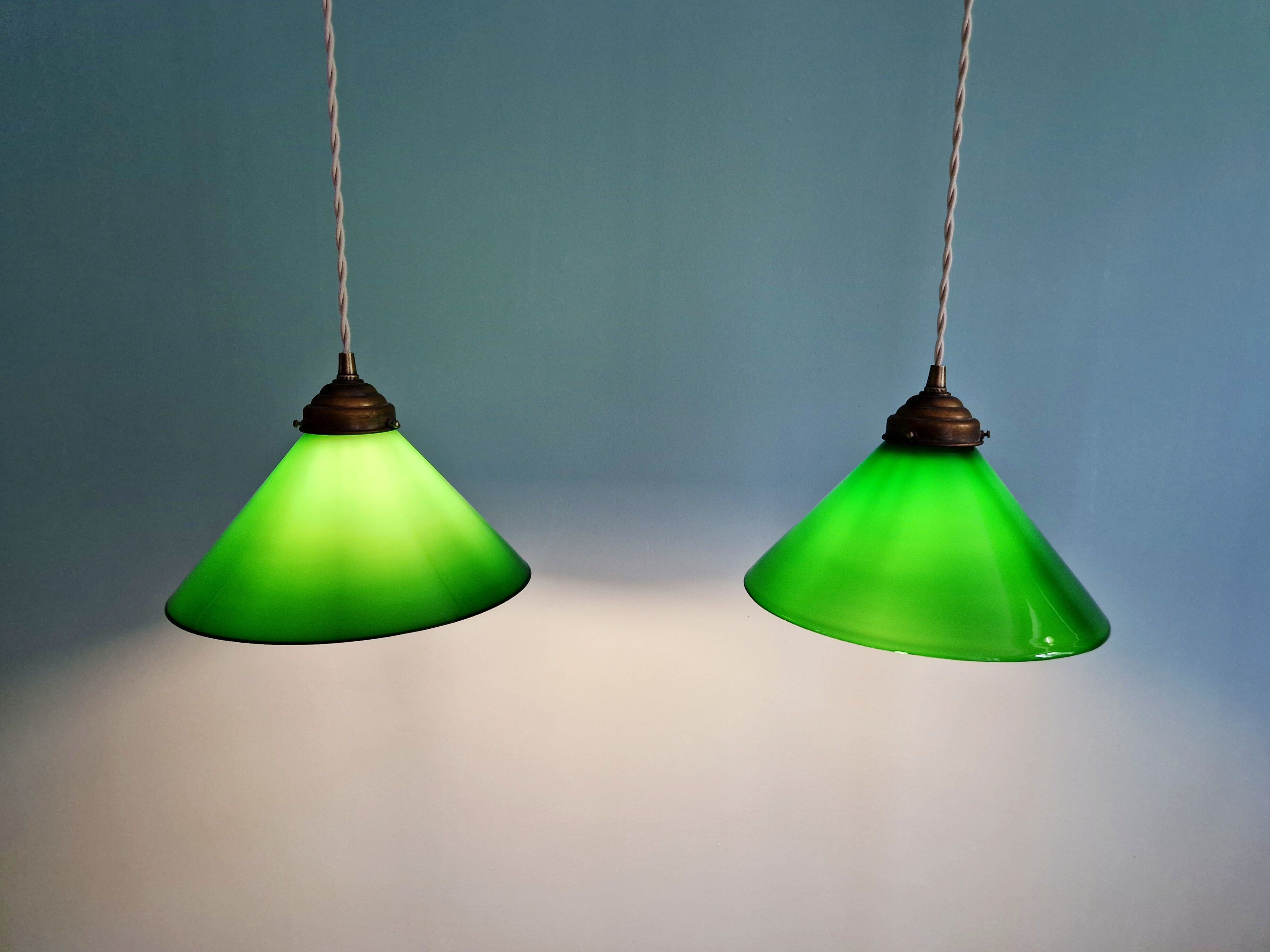 Pair of conical green opaline pendant lights, Art Deco style