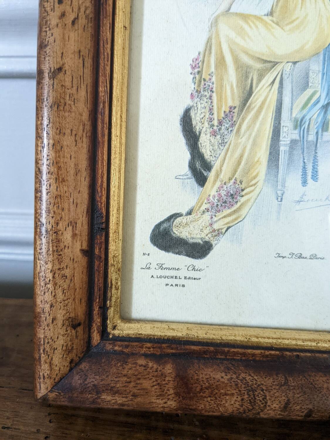 Two reproduction frames of engravings