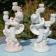 Pair of "cherub" candle holders in plaster