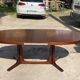 Baumann round oval extendable Scandinavian table in rosewood with 2 extensions.
