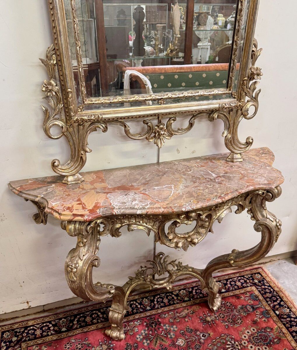 Important console table with a curved shape + Louis XV style mirror in gilded and silvered wood.