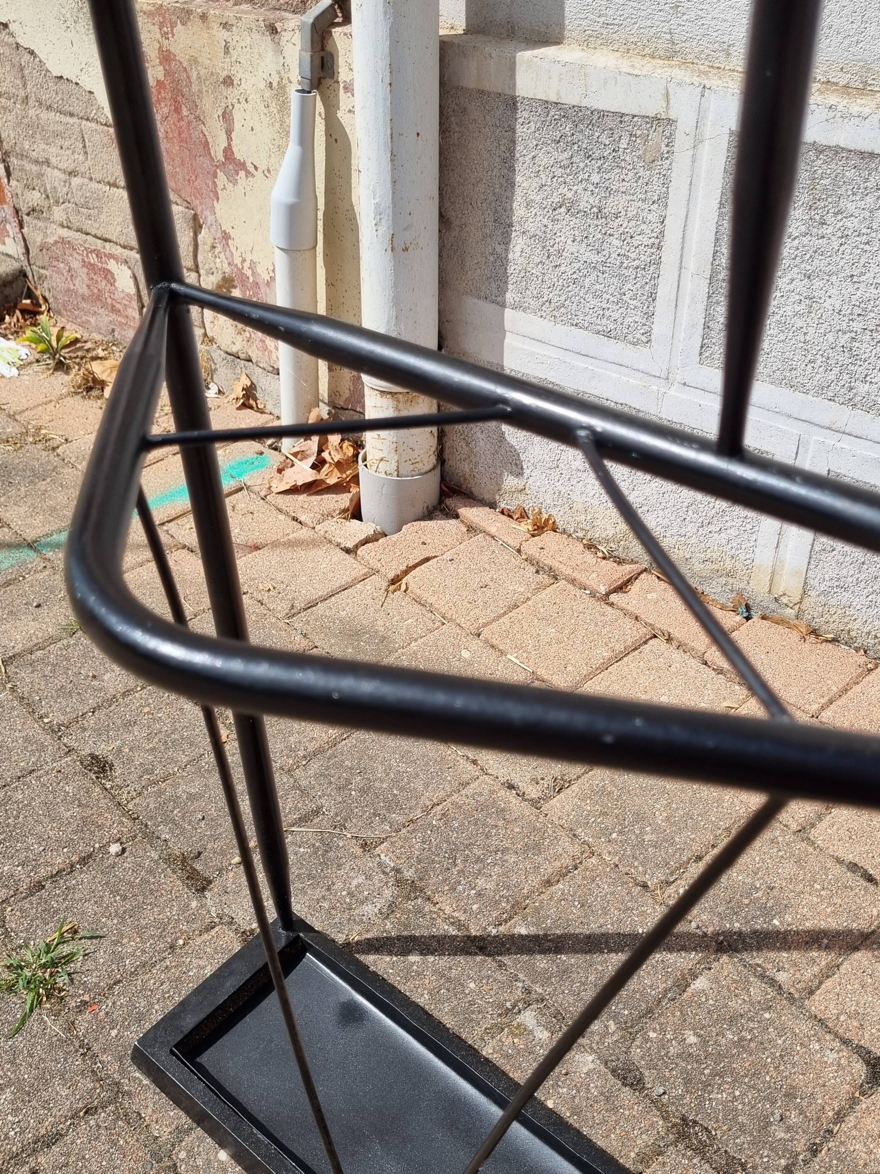 Postmodern entrance wardrobe from the 1980s in black metal and Bakelite, 180 cm.