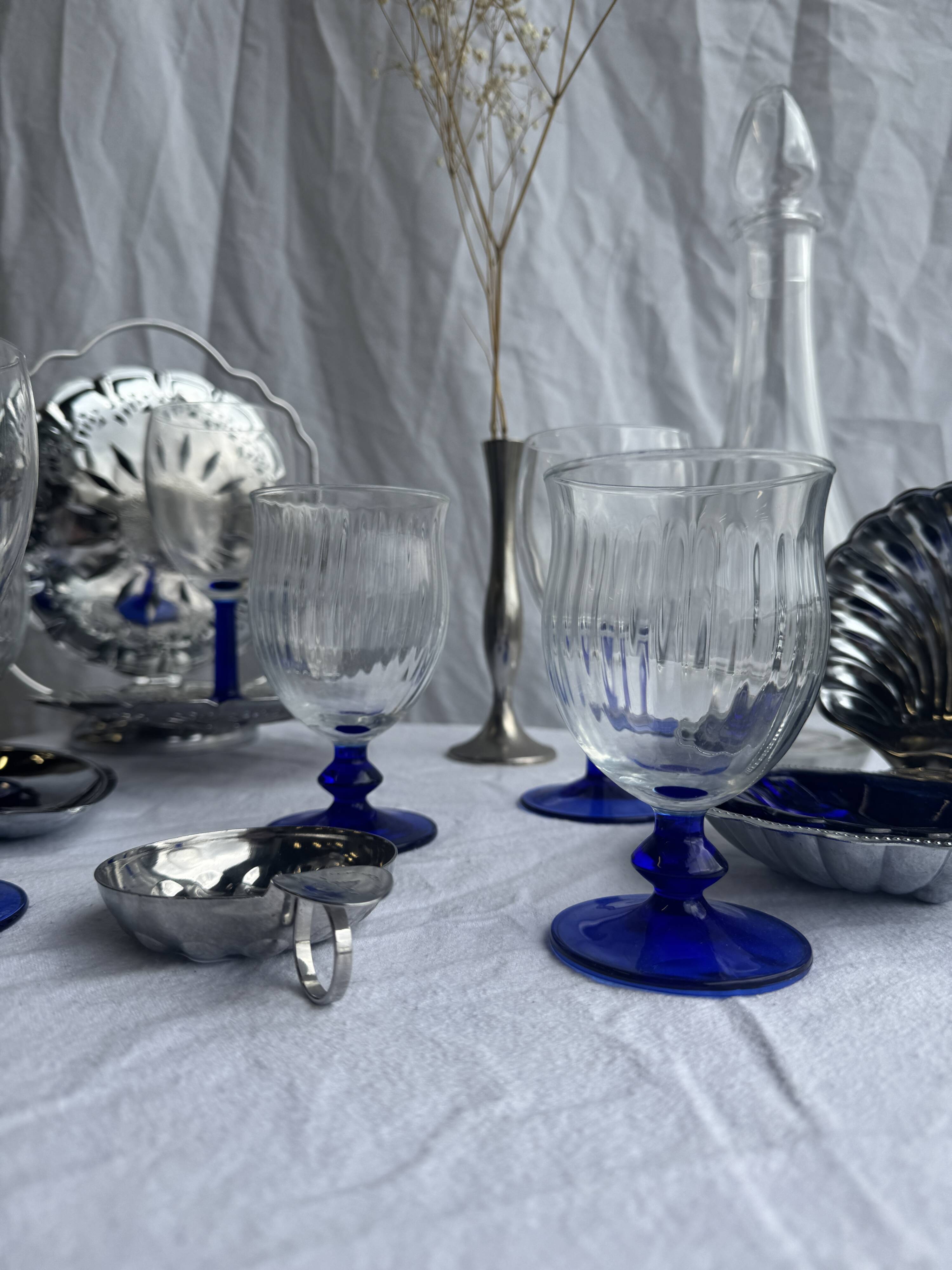 Set of 3 large blue stemmed glasses and 3 small blue stemmed glasses