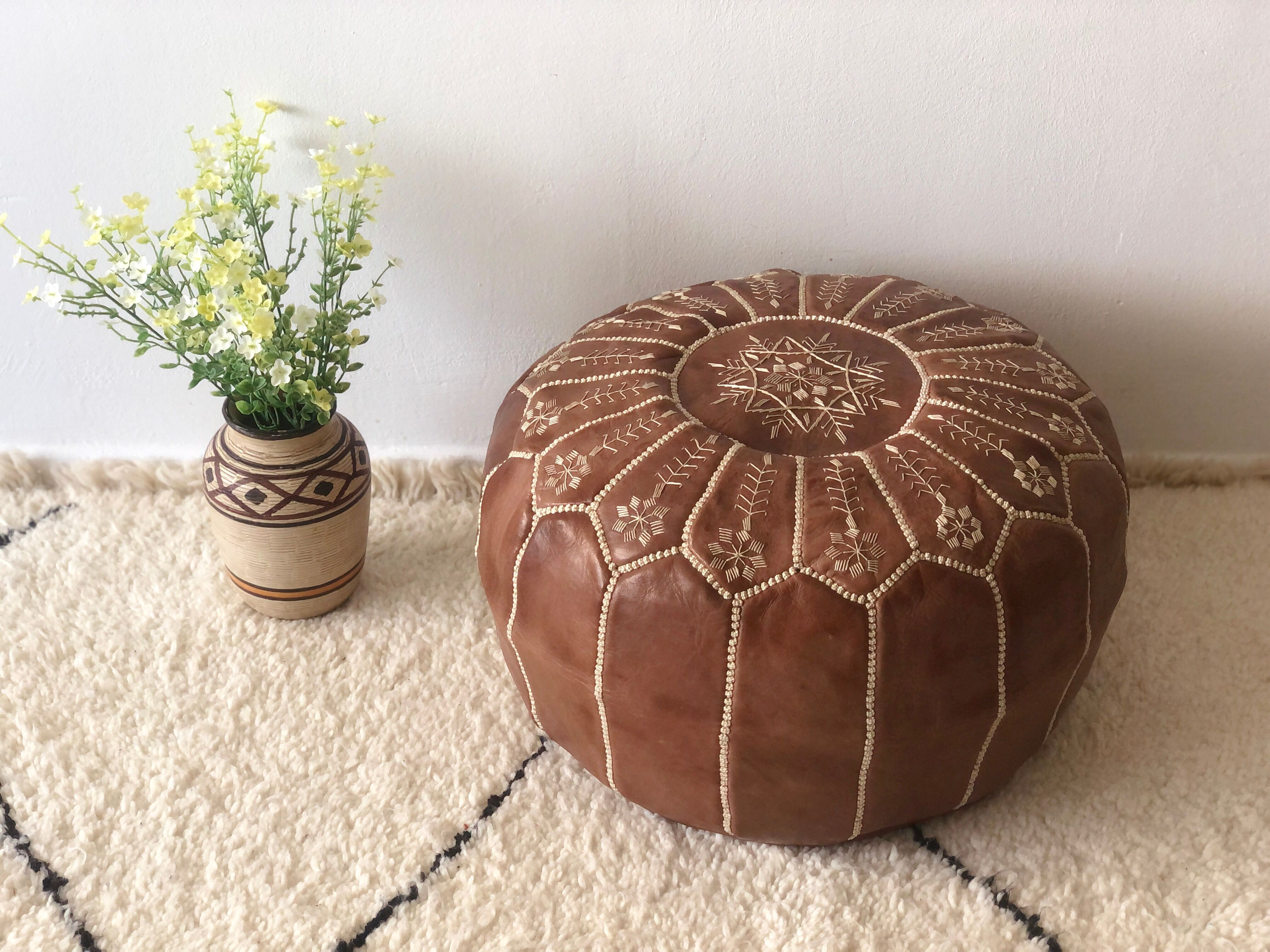 Moroccan-style brown leather pouf