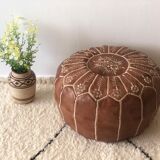 Moroccan-style brown leather pouf