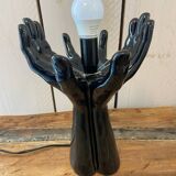 Lamp hands holding a globe