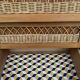 Vintage rattan chest of drawers with splayed legs from the 1950s.