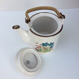 Vintage teapot with wicker handle