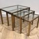 Set of 3 nesting tables in brass and glass. French work by Guy Lef.