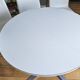 Extendable round table in white formica and 4 matching chairs by Roche Bobois.