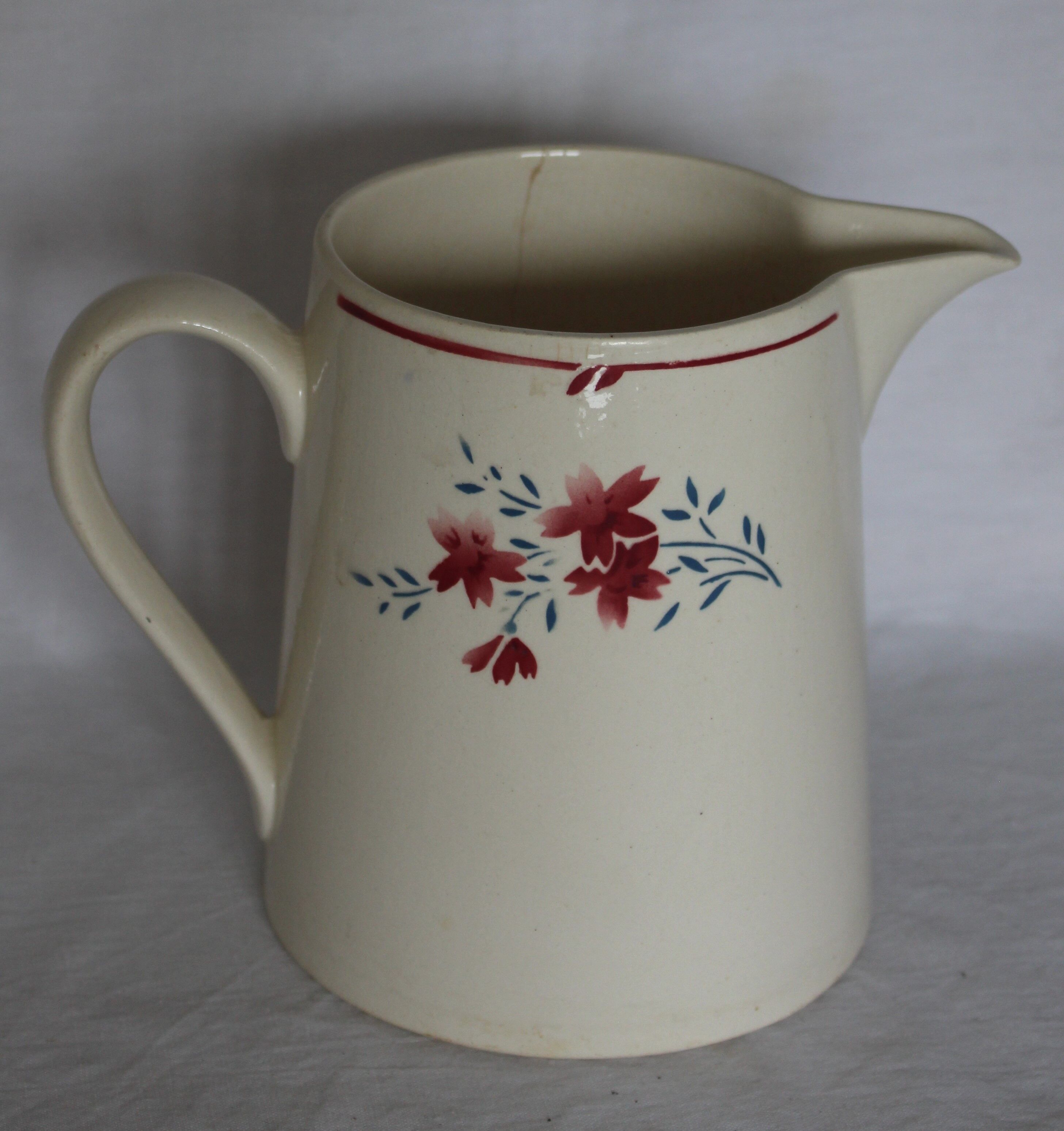 Small pitcher in half-porcelain "floral motif"