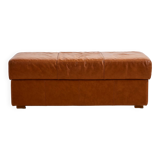 Ottoman with leather upholstery